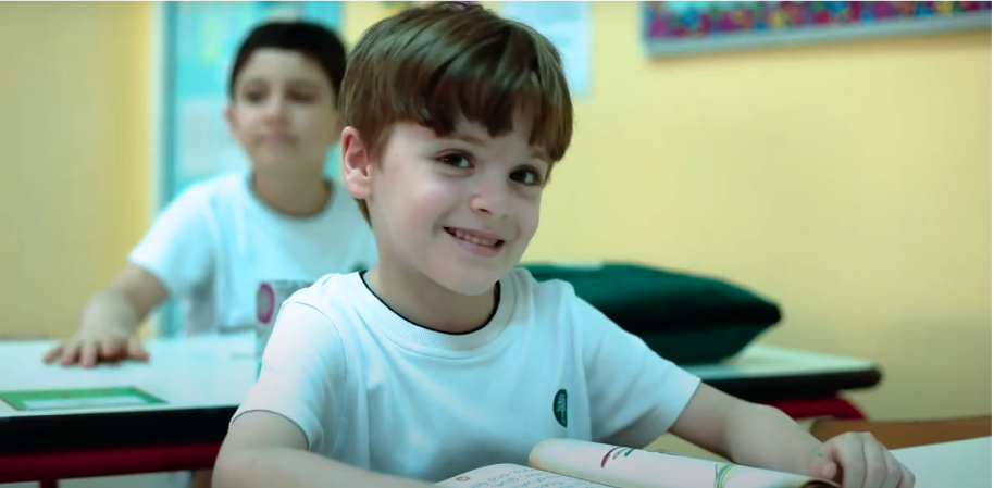 Student in class smiling